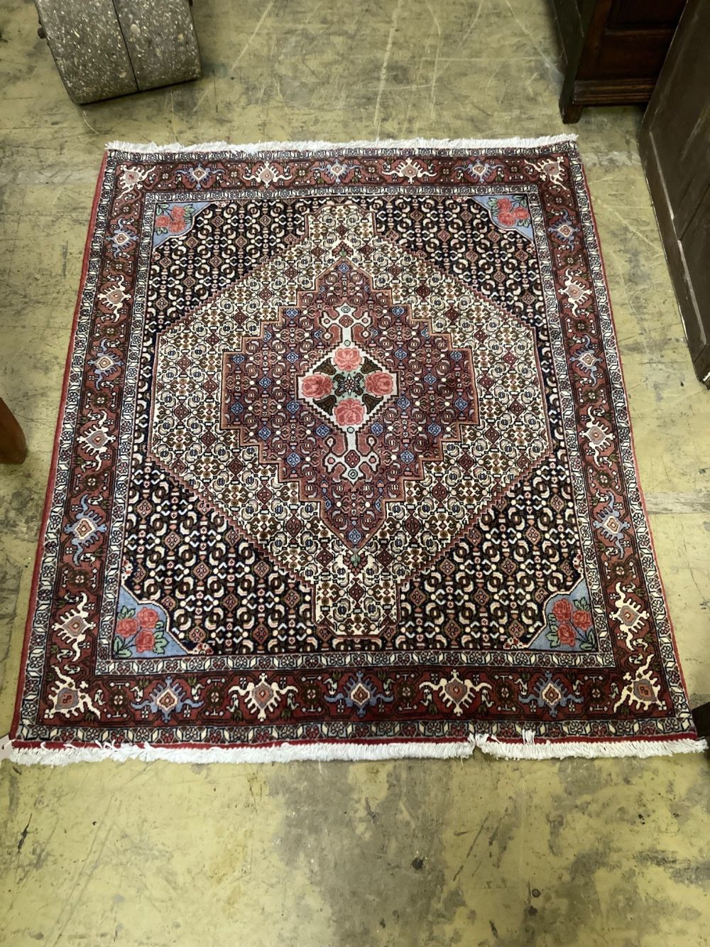 A Hamadan red ground rug, 150 x 126cm